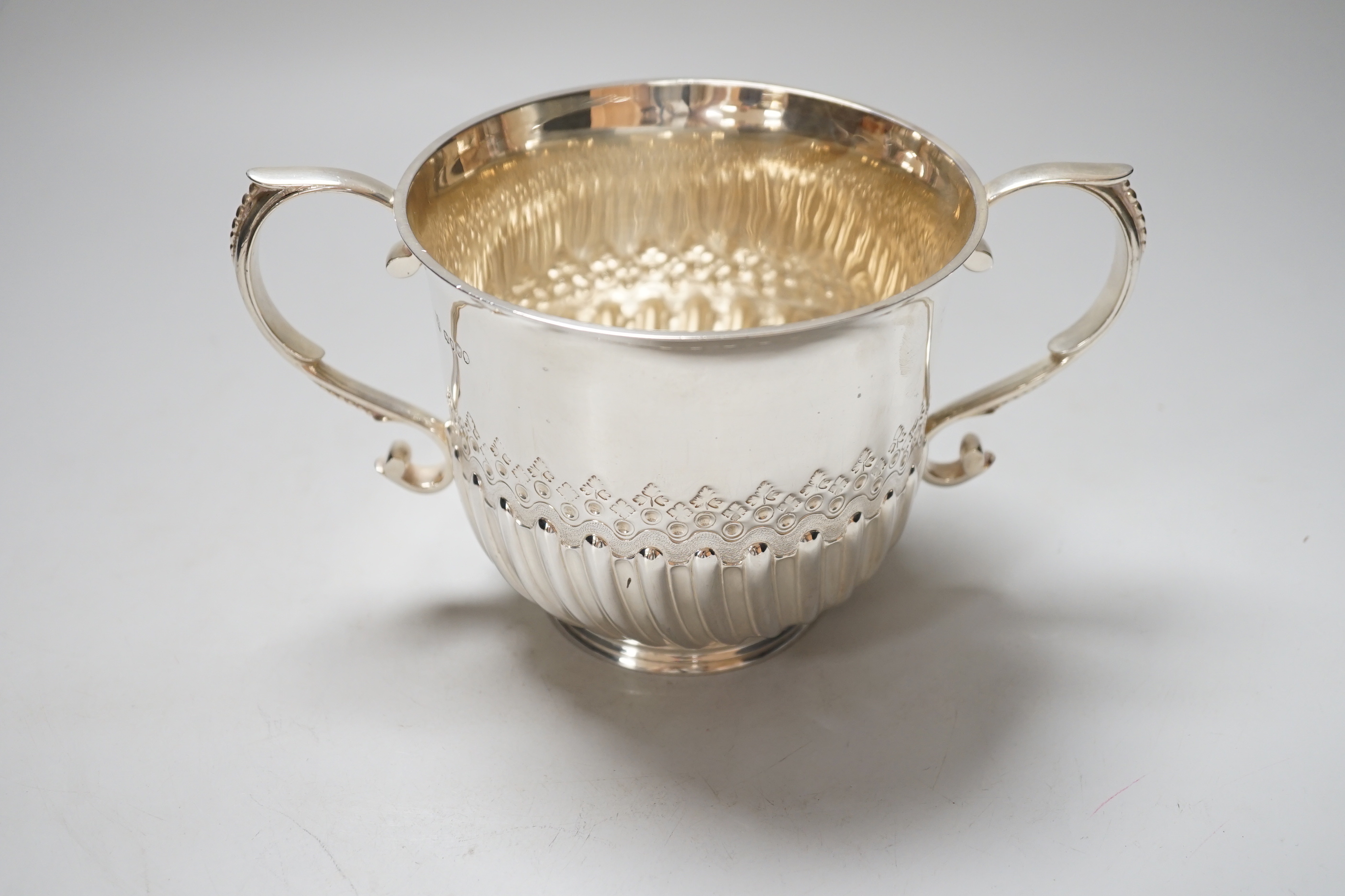 A Victorian silver loving cup, with scroll handles and demi-fluted body, London 1878, 21cm over the handles, 410 grams